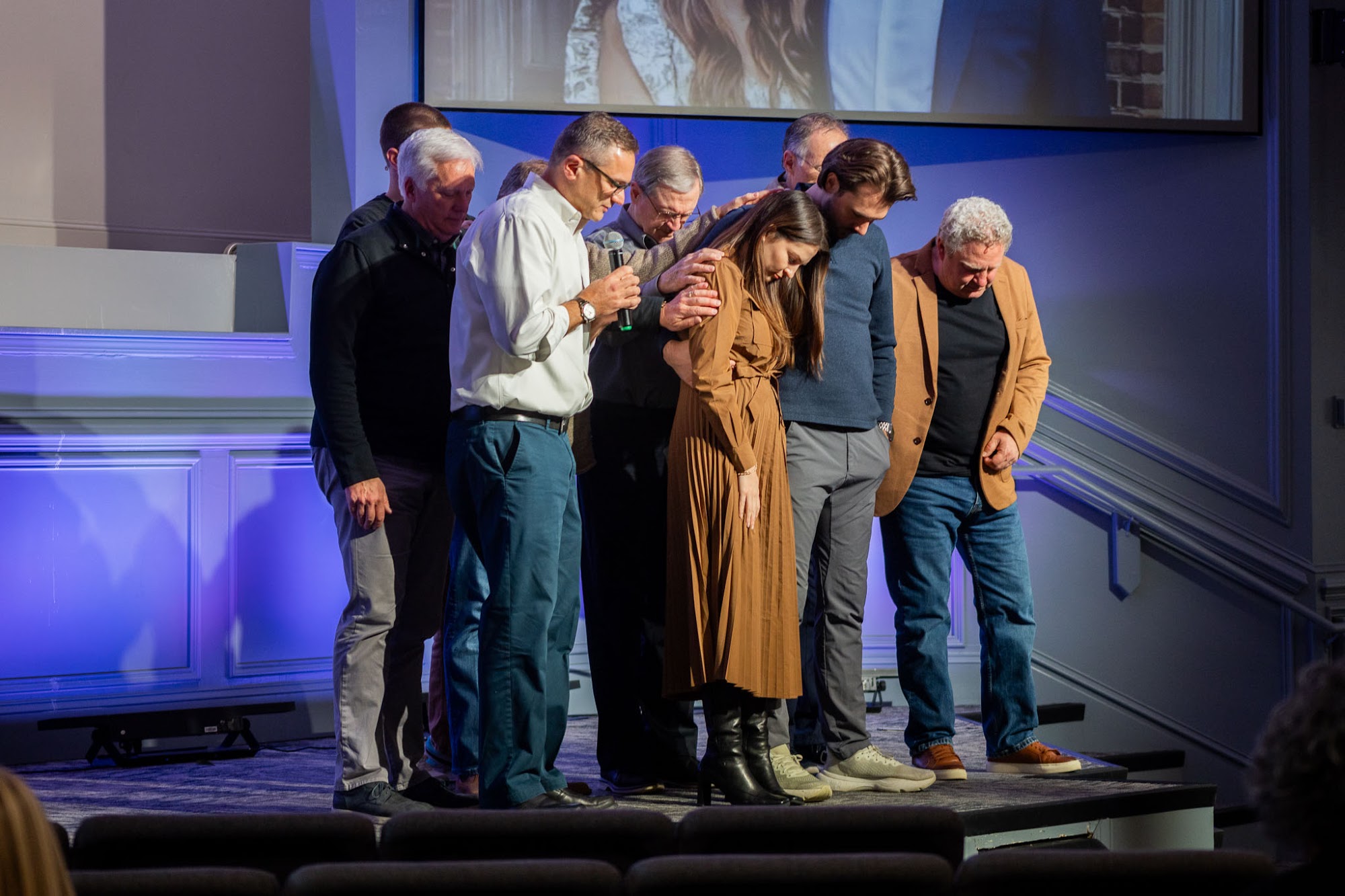Members gathered in a prayer circle at East Cobb Church of Christ